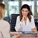 mid-aged businesswoman holding an interview with a female applicant