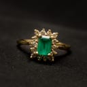 Vintage golden ring with a green jewel