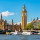 The iconic Big Ben and the Houses of Parliament alongside the Westminster Pier in London, UK.