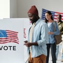 A young man at a voting booth