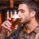 Man drinking beer from a glass