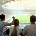 People enjoying a soccer match at a stadium