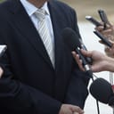 a businessman giving a statement to the media