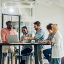 Group of people in an office socializing