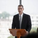 senior businessman standing at podium giving a speech addressing a conference in seminar. old executive man presentation in Meeting at office on window with colleagues