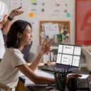 A graphic design team brainstorming and showcasing their creative skills in an office.