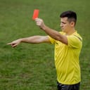 A soccer referee showing a red card