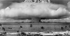 Black and white photo capturing the moment of a nuclear explosion in the ocean