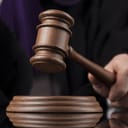 Gavel being struck against the sound block