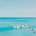 View of the ocean with people surfing