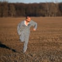 a fugitive running in a field