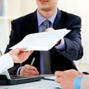 A person having over a printed document
