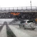 Storm warning sign on an overpass