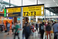 Airport terminal full of passengers