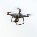 drone equipped with a digital camera flying in the sky