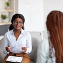 Woman talking to her therapist at an office