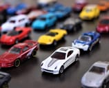 Collection of miniature toy cars displayed on a table