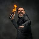 portrait of an angry man holding a Molotov cocktail, getting ready to throw it