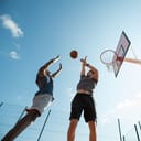 Two men playing basketball one on one