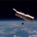 The Hubble Space Telescope (HST) begins its separation from Space Shuttle Discovery following its release on mission STS-82.