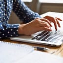 Close up image female hands typing on laptop keyboard. Businesswoman text response to client e-mail, customer buy on-line using web shop services. Internet and modern wireless technology usage concept