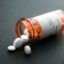 Open bottle of pills