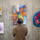 adult man observing art on wall artistic expression absract