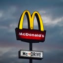 A "McDRIVE" sign outside a McDonald’s restaurant
