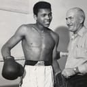 Cassius Clay (i.e. Muhammad Ali) and his trainer Joe E. Martin.
