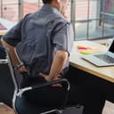 Asian hard senior businessman working with laptop computer has a problem with back pain. Old man feeling pain after sitting at desk long time, Healthcare and medicine office syndrome concept