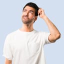A man scratching his head trying to remember