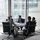 A team meeting at a round table in an office