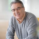 Middle aged man smiling into the camera