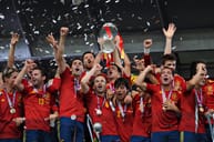 Spanish soccer team holding the Euro 2012 trophy. 