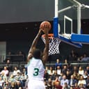 Basketball player about to score a point