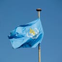 flag of the World Health Organization (WHO) against blue sky