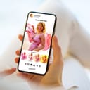 Woman editing a photo on her mobile phone to post on social media.