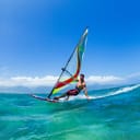 Man windsurfing in the ocean