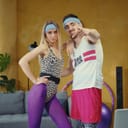 A caucasian couple of retro fitness athletes posing together.