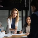 A female consultant talking at a meeting