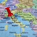 Map of Southern Europe with a pin dropped on Italy