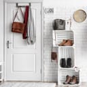 Foyer area in a home with various clothing items around