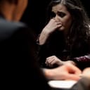 A woman being interrogated by a police officer