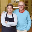 portrait of a daughter and her father in their shop