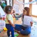A woman playing with a child