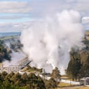 aerial view of the Wairakei Geothermal Power Station with steam rising from it