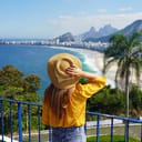 female traveler admiring the view of Copacabana beach in Rio de Janeiro, Brazil