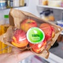 Woman holding package of ecologically grown apples, concept of eating healthy natural products