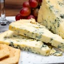 Close-up of a semi-soft, crumbly aged Stilton blue cheese made from cow's milk.