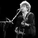 Portrait of Bob Dylan playing guitar, from the Santana and Bob Dylan concert in Barcelona, 1984.